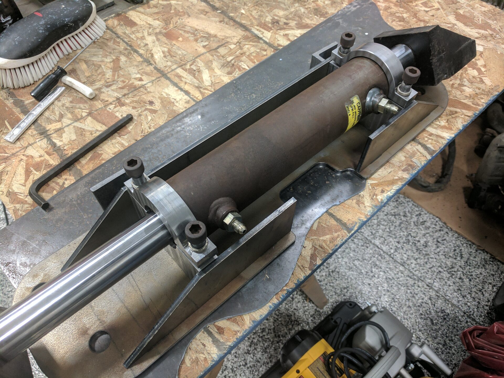 Welded electric-over-hydraulic rear steer system